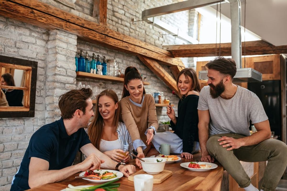 Enjoying Vegetarian Cooking Enjoying Vegetarian Cooking | A group of smiling people enjoying a meal