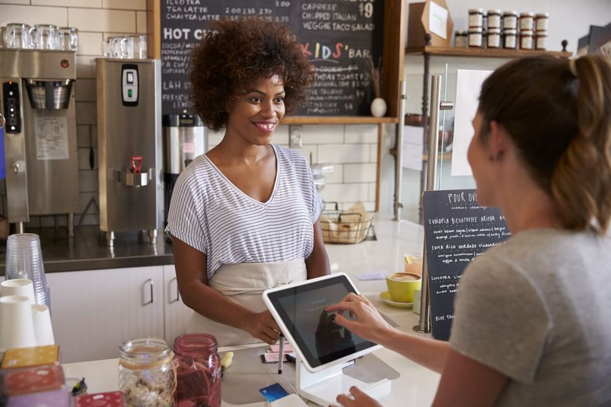Experience the Charm of Chapel Hill Experience the Charm of Chapel Hill | Image of smiling cashier and customer
