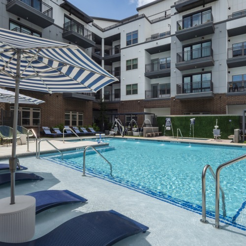 Pool deck with hot tub, BBQ grills, & more