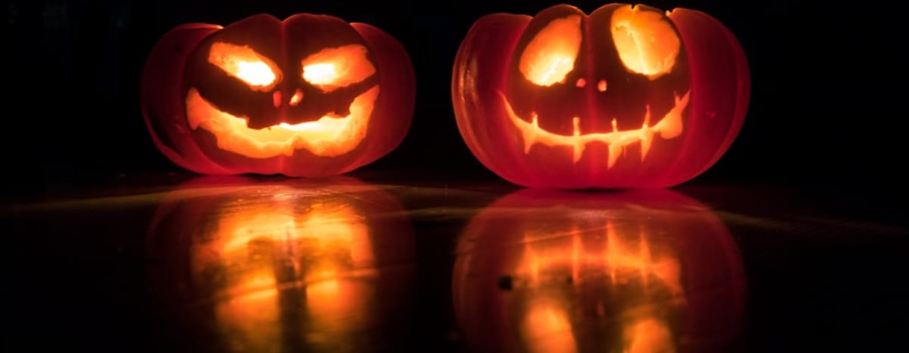 Apartment Amenity | Two glowing jack-o'-lanterns at night
