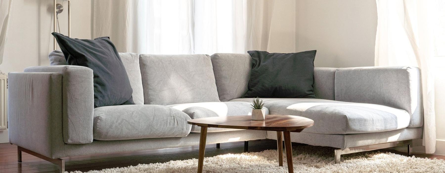 oversized windows brighten spacious, furnished living room