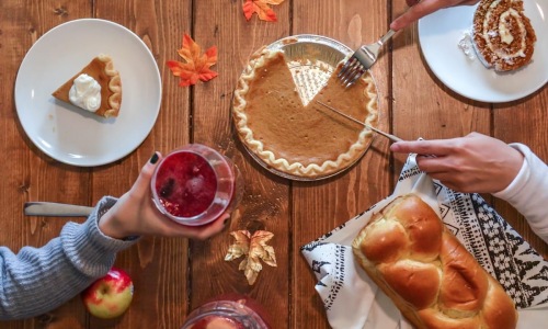 Apartment Amenity | Pumpkin pie and bread on wood table