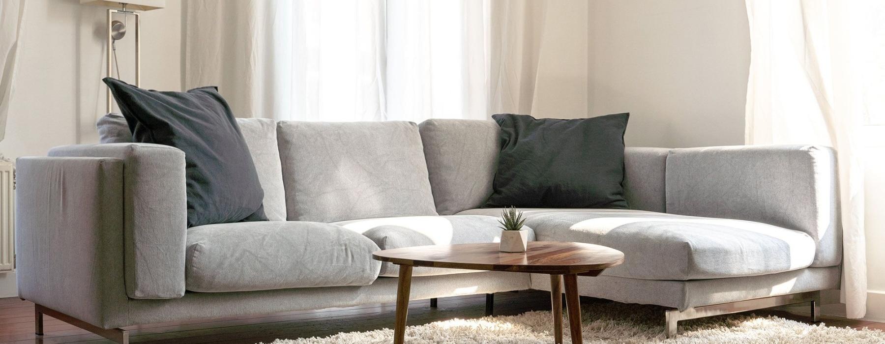 oversized windows brighten spacious, furnished living room