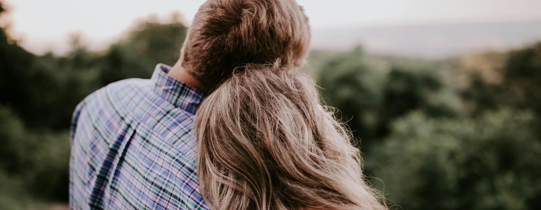 a man and woman kissing